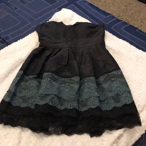 Cute black dress with blueish green lace detail